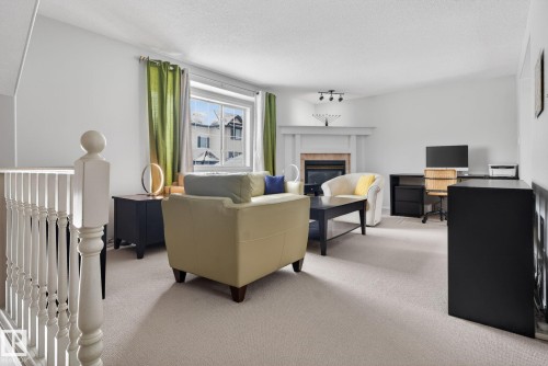 27 225 Blackburn Drive E, Edmonton, AB - Indoor With Fireplace