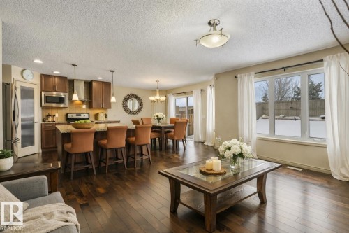 Open-concept living space with dark wood-finish flooring - 21851 80 Avenue, Edmonton, AB - Indoor Photo Showing Living Room