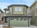Two-story residence featuring light green siding and dark trim accents - 21851 80 Avenue, Edmonton, AB  - Outdoor With Exterior 