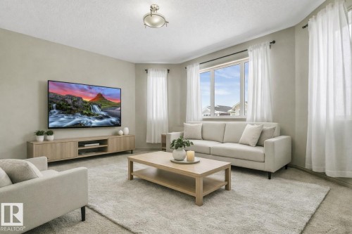 Living room featuring soft neutral wall tones and plush carpet flooring - 21851 80 Avenue, Edmonton, AB - Indoor Photo Showing Living Room