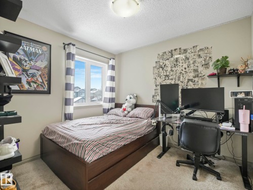 Light-colored walls defining a room with a single window - 21851 80 Avenue, Edmonton, AB - Indoor Photo Showing Bedroom
