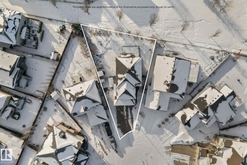 Aerial view of the property and its surrounding neighborhood, featuring roofs with varying pitches and a snow-covered landscape - 112 Lakeland Point(E), Beaumont, AB - Other