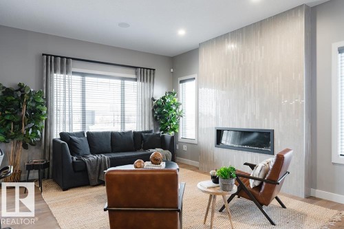 9389 Cooper Bend Bend, Edmonton, AB - Indoor Photo Showing Living Room With Fireplace