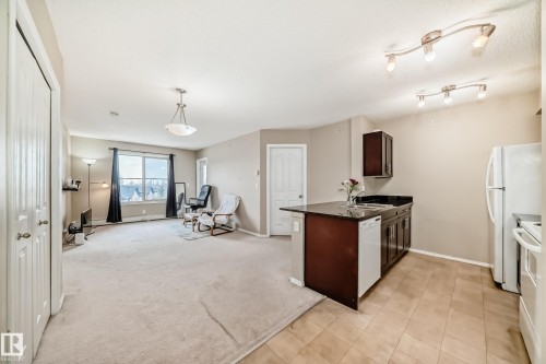 Open-concept living area with integrated kitchen - 404 12025 22 Avenue Sw, Edmonton, AB - Indoor Photo Showing Kitchen