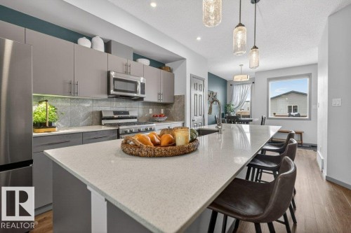 2405 Trumpeter Way, Edmonton, AB - Indoor Photo Showing Kitchen With Stainless Steel Kitchen With Upgraded Kitchen