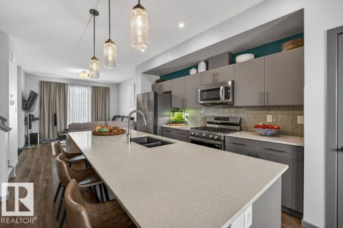 2405 Trumpeter Way, Edmonton, AB - Indoor Photo Showing Kitchen With Stainless Steel Kitchen With Double Sink With Upgraded Kitchen