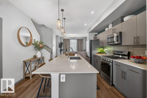 2405 Trumpeter Way, Edmonton, AB - Indoor Photo Showing Kitchen With Upgraded Kitchen