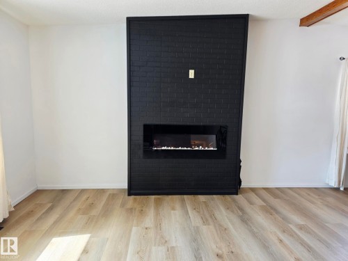 5204 43 Avenue, Leduc, AB - Indoor Photo Showing Living Room With Fireplace