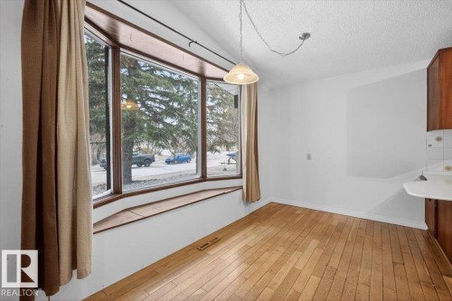 Bay window with wood-finish trim and integrated window seat - 6018 105A Street, Edmonton, AB 