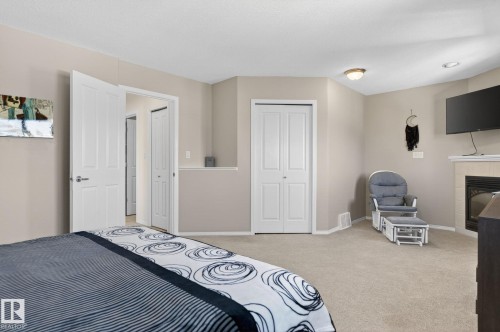 Neutral-toned walls and carpeting complement the white trim and doors - 1904 36 Avenue, Edmonton, AB - Indoor Photo Showing Bedroom