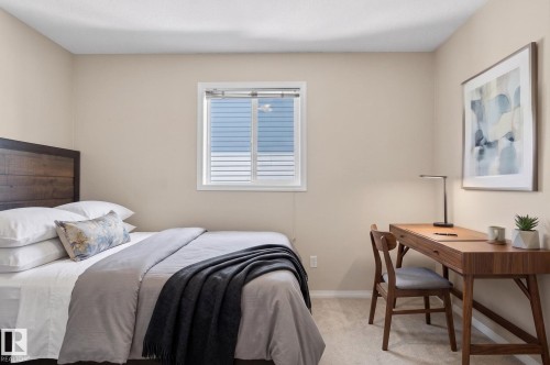 Bright room featuring light-colored walls and carpet flooring - 1904 36 Avenue, Edmonton, AB - Indoor Photo Showing Bedroom