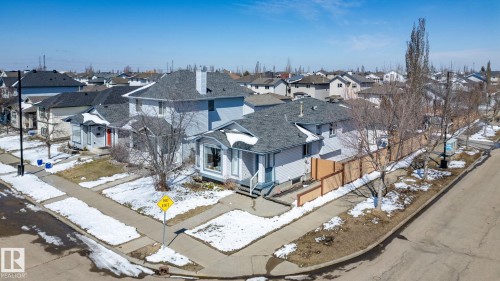 Two-story residence with light blue siding and a dark gray shingle roof - 1904 36 Avenue, Edmonton, AB - Outdoor