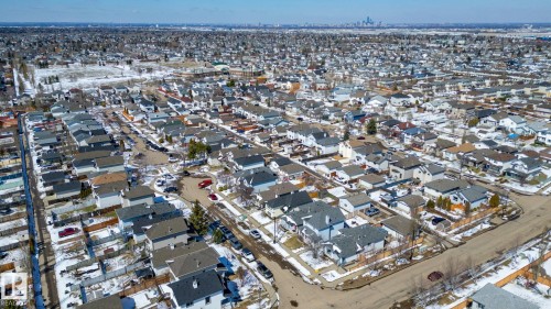 Aerial perspective of a residential neighborhood with a distant cityscape - 1904 36 Avenue, Edmonton, AB - Outdoor With View