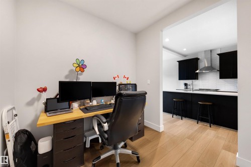 Bright workspace featuring light wood-finish flooring - 3193 Checknita Way, Edmonton, AB - Indoor Photo Showing Office