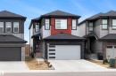 Modern two-story residence featuring a gray exterior with red panel accents - 3193 Checknita Way, Edmonton, AB  - Outdoor With Facade 
