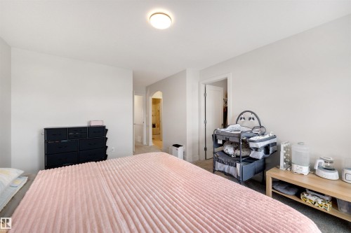 Carpeted bedroom with a neutral color palette - 3193 Checknita Way, Edmonton, AB - Indoor Photo Showing Bedroom