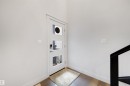 Entryway featuring a contemporary white door with three rectangular glass inserts and a smart lock - 3193 Checknita Way, Edmonton, AB  - Indoor Photo Showing Other Room 