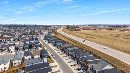 Aerial perspective showcasing a residential development alongside a major roadway - 3193 Checknita Way, Edmonton, AB - Outdoor With View