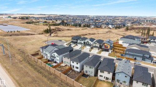 Aerial perspective showcasing a developing residential neighborhood with contemporary homes - 3193 Checknita Way, Edmonton, AB - Outdoor With View