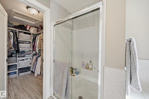 The bathroom features a glass-enclosed shower and a towel bar - 2018 Armitage Green, Edmonton, AB - Indoor Photo Showing Bathroom