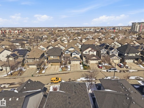This aerial view showcases the residential area, featuring properties with attached garages and driveways - 2018 Armitage Green, Edmonton, AB - Outdoor With View