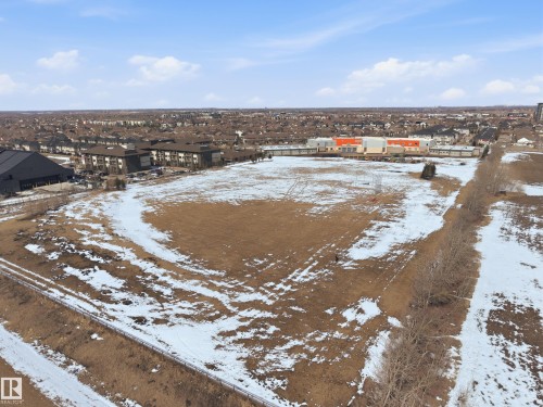 Expansive parcel of land featuring open brown ground with patches of snow - 2018 Armitage Green, Edmonton, AB - Outdoor With View
