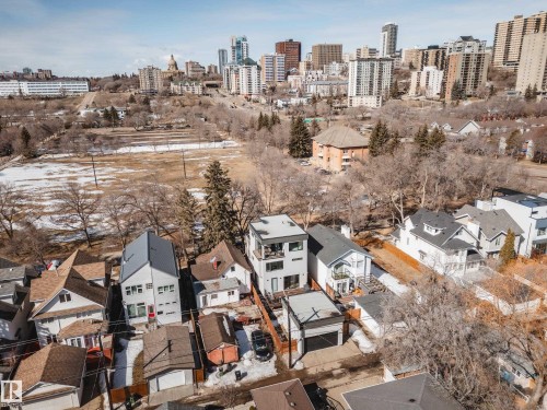 Contemporary multi-story residence featuring a flat roofline and integrated balcony - 9625 101 Street, Edmonton, AB - Outdoor With View