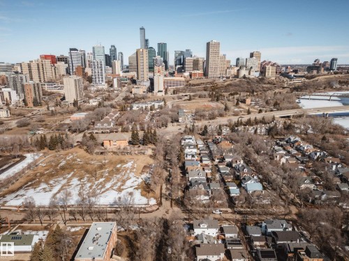 Aerial perspective showcasing a dense urban skyline, surrounding residential areas, and natural terrain - 9625 101 Street, Edmonton, AB - Outdoor With View