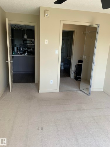 Light beige carpeted flooring - 307 6084 Stanton Drive, Edmonton, AB - Indoor Photo Showing Other Room