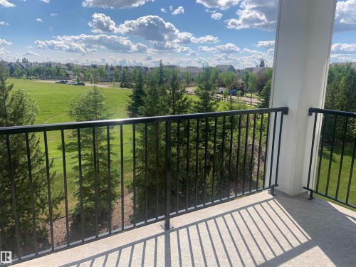 Outdoor balcony with black metal railings and a concrete surface - 307 6084 Stanton Drive, Edmonton, AB - Outdoor With Balcony With View