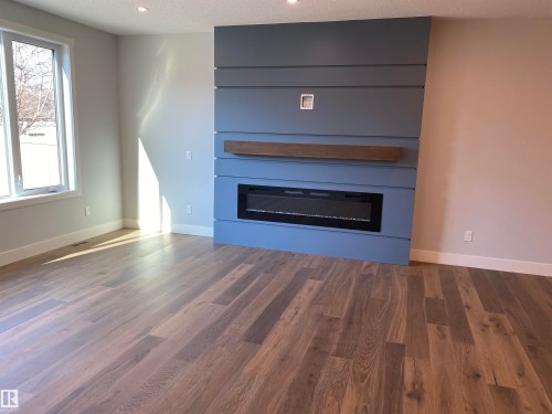 9515 75 Avenue, Edmonton, AB - Indoor Photo Showing Living Room With Fireplace