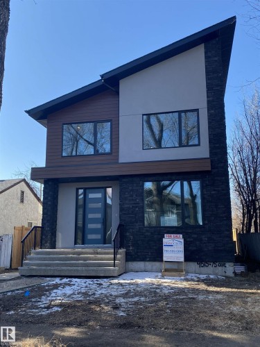 Contemporary-style exterior featuring stacked stone accents, wood-finish siding, and smooth stucco panels - 9515 75 Avenue, Edmonton, AB - Outdoor