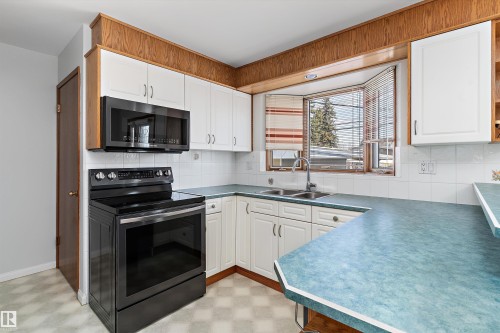 9411 68A Street, Edmonton, AB - Indoor Photo Showing Kitchen With Double Sink