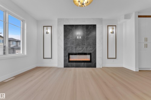 456 Crystal Creek Link, Leduc, AB - Indoor Photo Showing Living Room With Fireplace