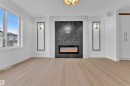 456 Crystal Creek Link, Leduc, AB  - Indoor Photo Showing Living Room With Fireplace 