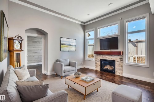 Virtually Staged Photo - 3 61 Lafleur Drive, St. Albert, AB - Indoor Photo Showing Living Room With Fireplace