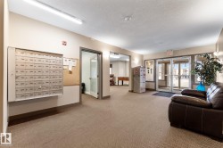 Common area featuring an entry way with glass doors, a mailroom, and a recreation area with a foosball table - 