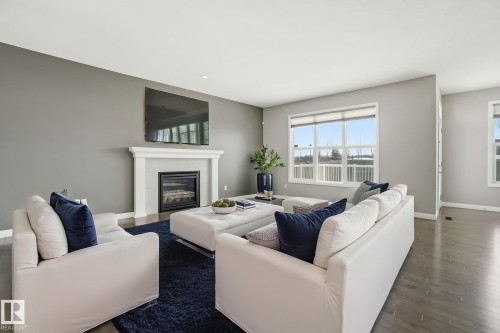 Virtually Stagged - 3875 Agar Green, Edmonton, AB - Indoor Photo Showing Living Room With Fireplace