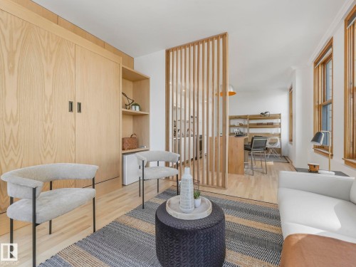The property features bright hardwood floors and large windows providing abundant natural light - 807 10134 100 Street, Edmonton, AB - Indoor