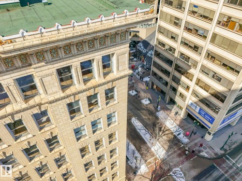 The property features a stone facade with ornate architectural details, including decorative friezes and cornices - 807 10134 100 Street, Edmonton, AB - Indoor Photo Showing Other Room