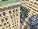 The property features a stone facade with ornate architectural details, including decorative friezes and cornices - 807 10134 100 Street, Edmonton, AB  - Indoor Photo Showing Other Room 