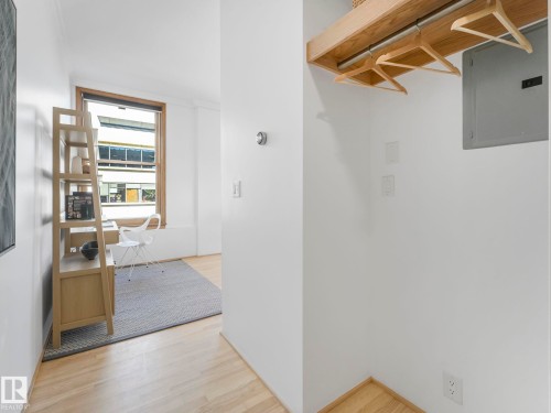 The property features light wood flooring and white walls, creating a bright and airy atmosphere - 807 10134 100 Street, Edmonton, AB - Indoor