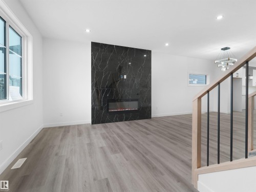 332 Roberts Wynd, Leduc, AB - Indoor Photo Showing Other Room With Fireplace