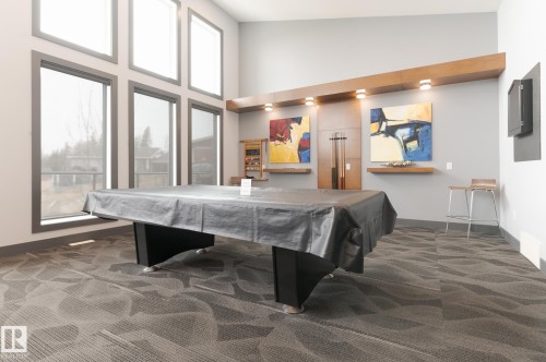 Social Area  Fireplace  Pool Table  Dart Boards and Coffee Station  Exercise Room  Banquet Room  Spacious Kitchenette  Flex Space For Meetings, Crafts, Card Tournaments - #207 50 Heatherglen Dr, Spruce Grove, AB - Indoor Photo Showing Other Room