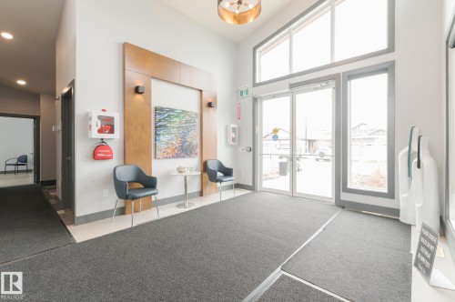 Social Area  Fireplace  Pool Table  Dart Boards and Coffee Station  Exercise Room  Banquet Room  Spacious Kitchenette  Flex Space For Meetings, Crafts, Card Tournaments - #207 50 Heatherglen Dr, Spruce Grove, AB - Indoor Photo Showing Other Room