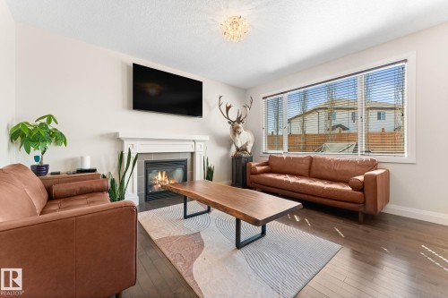 8 Spring Bay, Spruce Grove, AB - Indoor Photo Showing Living Room With Fireplace