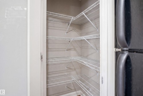 Corner pantry featuring multiple white wire shelving units - 3533 11 Street, Edmonton, AB - Indoor With Storage