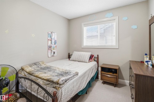 Neutral wall paint with textured carpet flooring - 3533 11 Street, Edmonton, AB - Indoor Photo Showing Bedroom