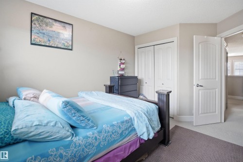 Carpeted room with neutral wall color and textured ceiling - 3533 11 Street, Edmonton, AB - Indoor Photo Showing Bedroom