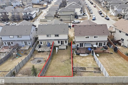 Expansive backyard featuring a partially fenced perimeter and a central grassy area - 3533 11 Street, Edmonton, AB - Outdoor